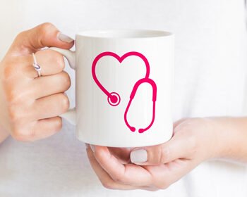 Woman holding mug with stethoscope
