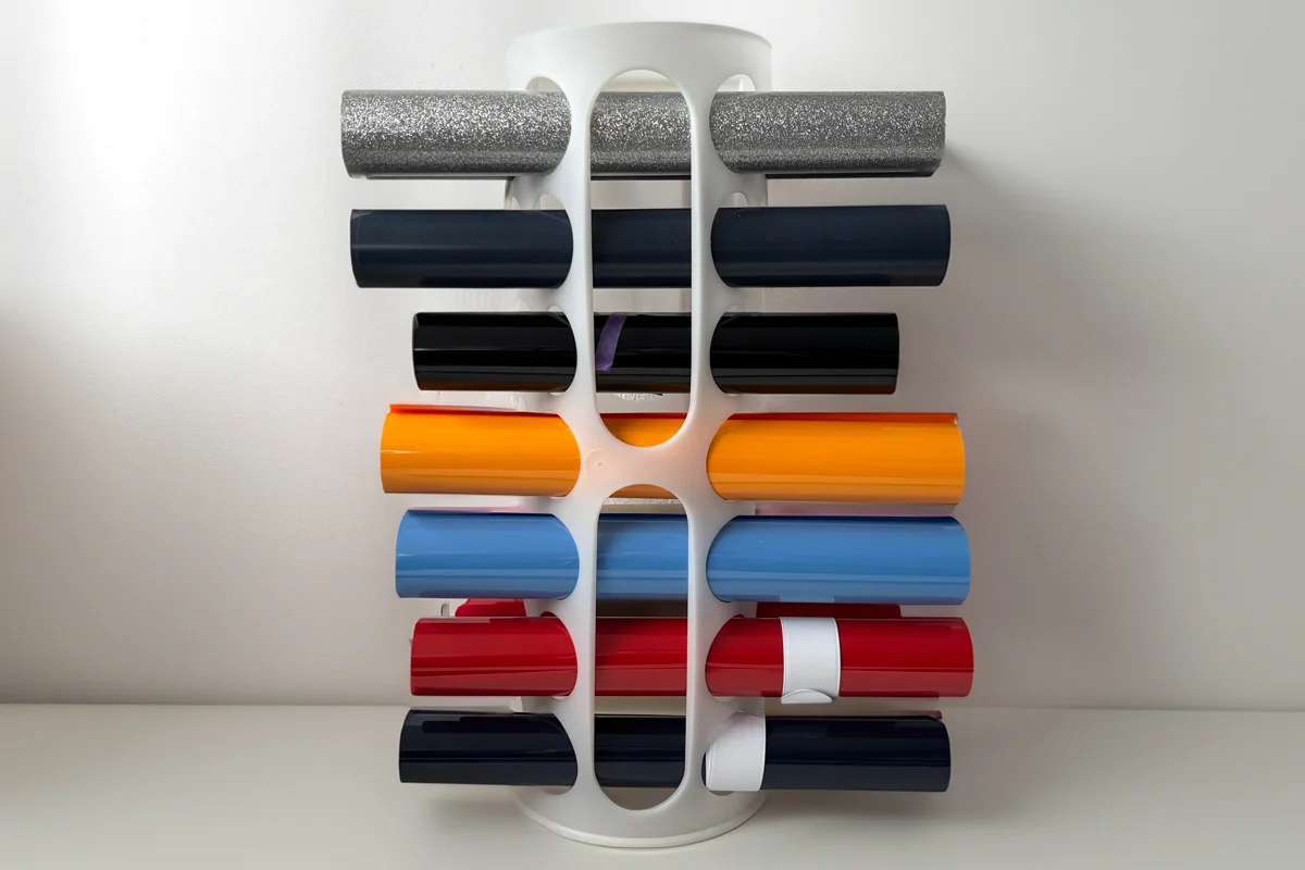 Vinyl roll storage organizer holding colorful Cricut vinyl rolls