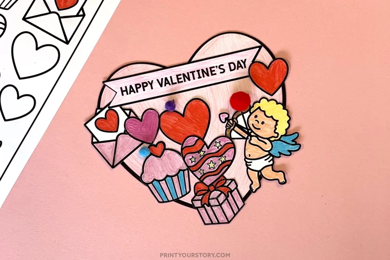 Cut-and-paste Valentine’s Day coloring card with hearts, envelopes, cupcakes, and cupid on pink paper