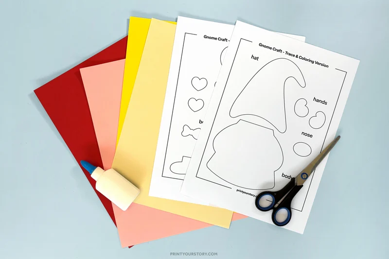 Valentine gnome craft templates with colored paper, scissors, glue, and markers