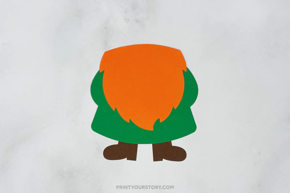 Paper St. Patrick’s Day gnome craft with green body, orange beard, and brown boots