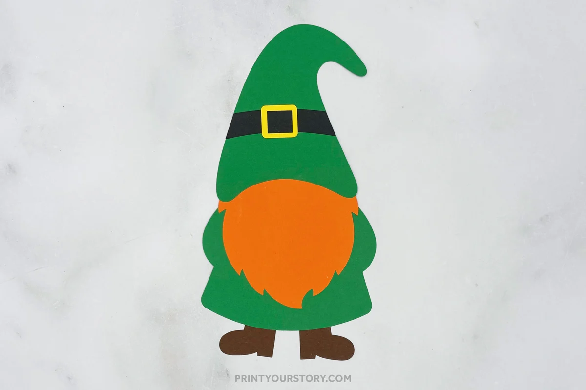 Paper St. Patrick’s Day gnome craft with green hat, orange beard, and brown boots