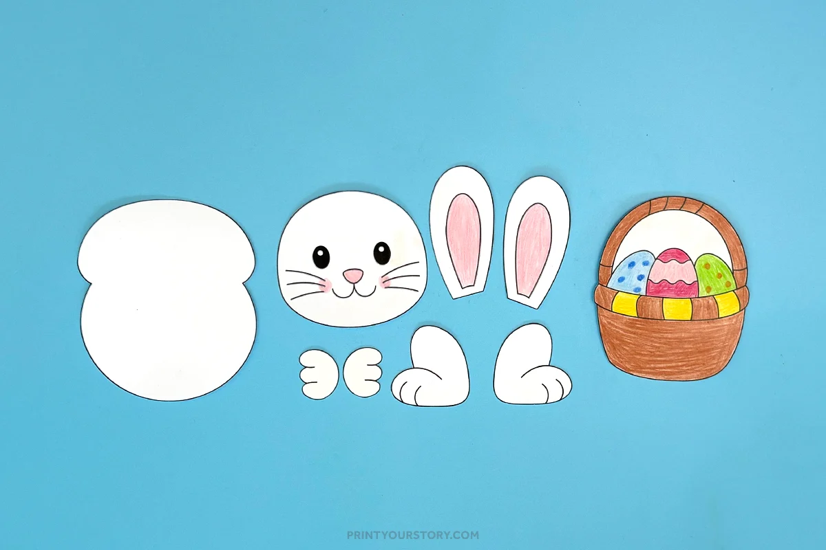 Easter bunny printable craft pieces with bunny body, face, ears, paws, and basket of eggs on blue background