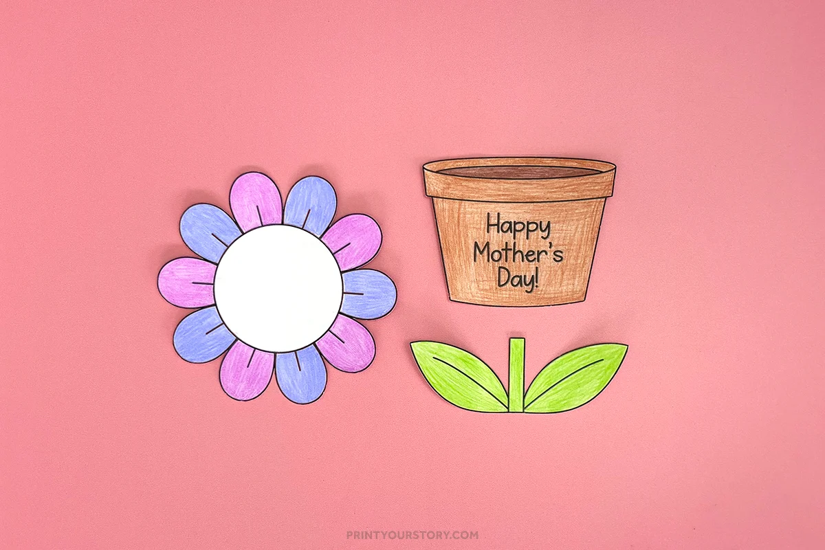 Cut-out paper flower, leaves, stem, and flower pot labeled “Happy Mother’s Day!” on pink paper