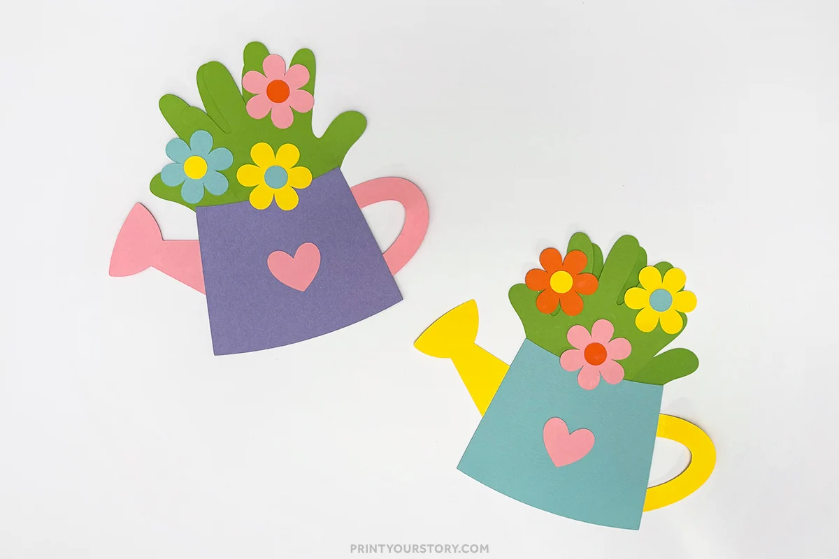 Paper handprint watering can crafts with colorful flowers and heart decorations