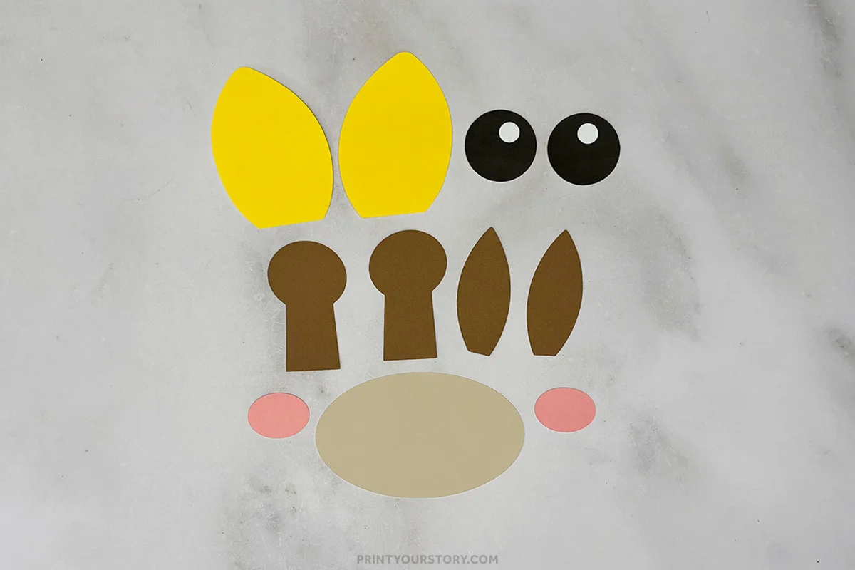 Cut paper pieces for a giraffe paper plate craft