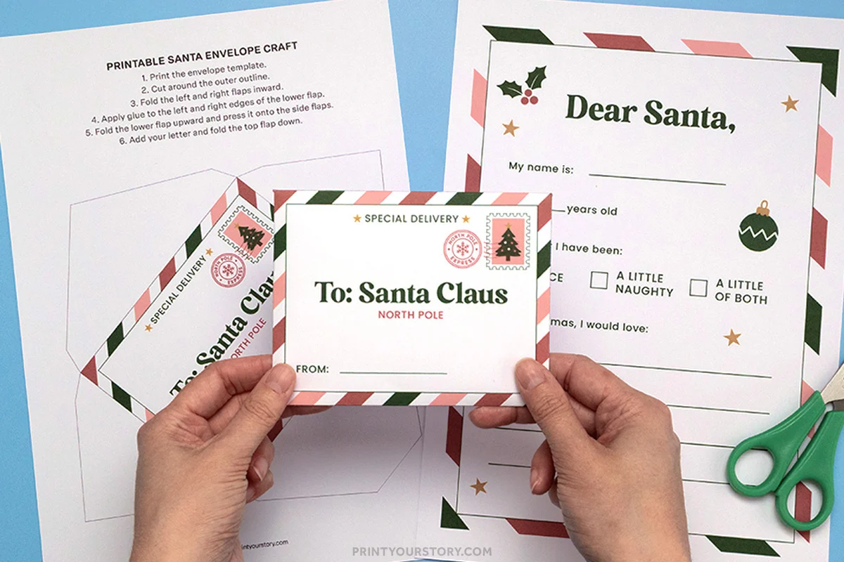 Printable letter to Santa and matching envelope template with holiday border, held over cut-and-fold envelope pieces